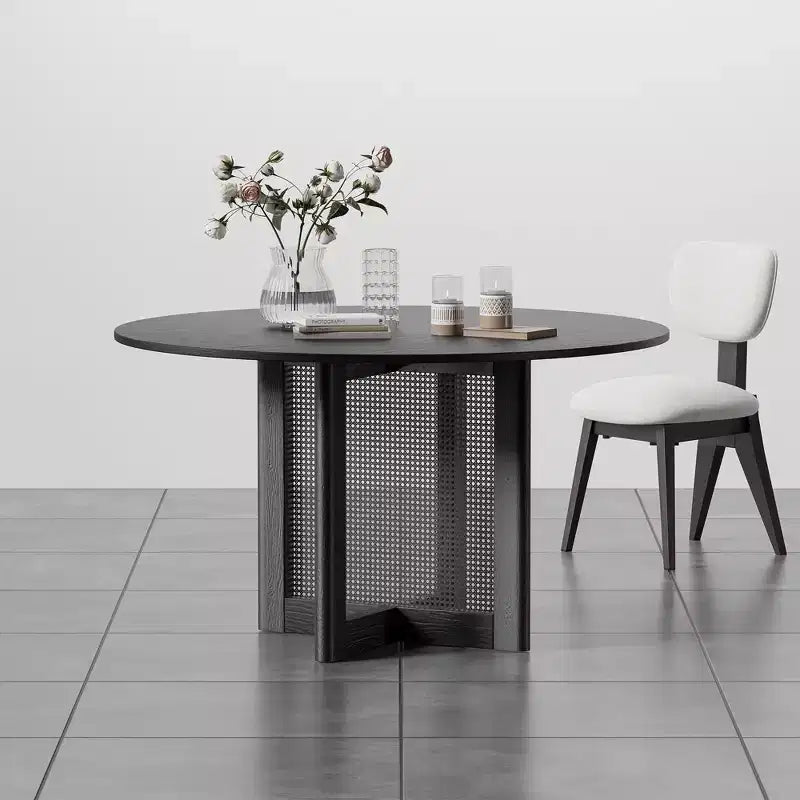 Table à manger ronde noire avec pieds en rotin, 6 places